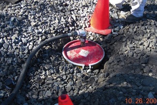 Leachate Collection Sump Between Tracks with
Pump Out Stinger