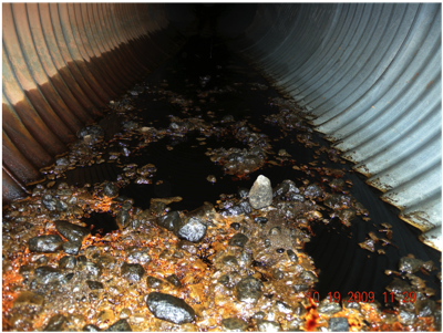 Culvert Draining Fuel from Adjacent Facility