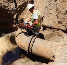 Cutting Ductile Iron Pipe to Install New Manholes