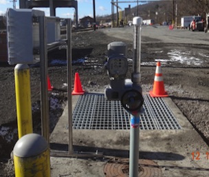 Automated Sluice Gate, Hydrocarbon Sensor, & Control Box Installed in Weir Box